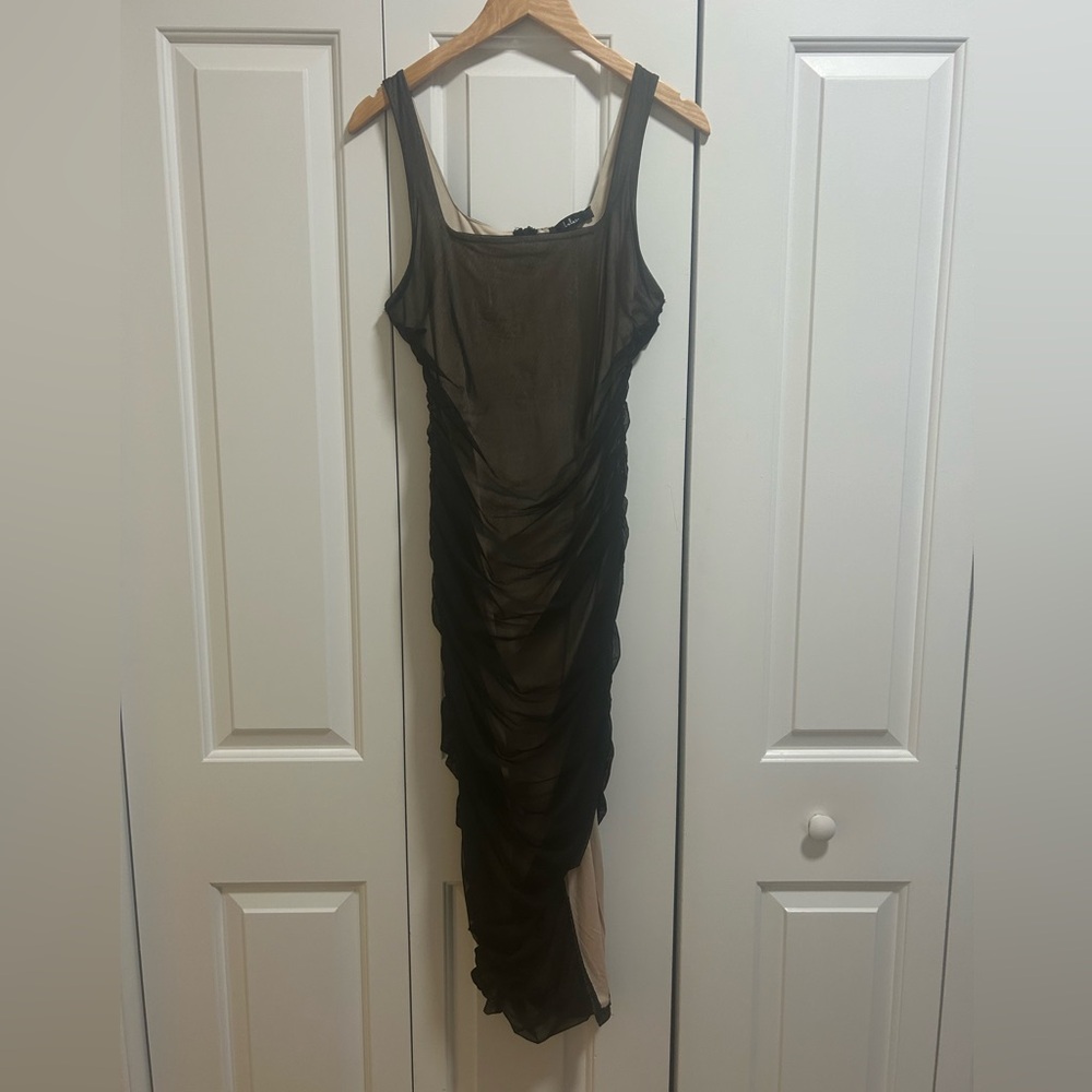 Black sheer body-con dress. Slit on side. Very flattering. LULUS.